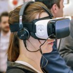 Blackjack spelen in virtual reality Virtual reality, oftewel VR, is inmiddels niet meer zo erg vreemd meer. Zeker in de wereld van games zie je het steeds vaker voorbij komen. En niet langer zijn het alleen video games die op deze manier naar een volgend niveau getild worden. Er zijn ook een heleboel andere spellen die met virtual reality een extra dimensie krijgen. Zo hebben ze bij ‘Casinopia: the Blackjack’ het spel blackjack in de aanbieding in de VR wereld. Het is ontworpen door OneImmers en gepubliceerd door YJM Games. Je kunt dit spel verkrijgen in de Steam Store. Hier kun je dus VR blackjack spelen wanneer jij dat wilt en in een leuke setting. Ook als beginnende speler kun je hier uiteraard terecht voor een leuke manier van blackjack spelen. Hoe kan ik blackjack spelen in virtual reality Lijkt het jou wel wat om blackjack spelen in de virtuele realiteit plaats te laten vinden? Dan kan dit met de HTC VIVE. Deze VR headset biedt precies wat je nodig hebt op dit gebied. Van kenmerken zoals een bewegingssensor tot een chat systeem waarbij je gewoon kunt praten. Er is zelfs de mogelijkheid om aankopen te doen in de game om je ranking in het spel te verbeteren. Als jij nu al denkt dat Blackjack spelen leuk is, dan wordt het met deze kenmerken nog vele malen leuker. En als jij tot de groep mensen behoort die het altijd een beetje saai vond om te kiezen voor blackjack spelen, dan is dit helemaal de moeite waard! Hiermee ga je het spel voor altijd waarderen. Meer halen uit blackjack spelen Dat de virtuele realiteit alles een stuk spannender kan maken dat staat als een paal boven water. Zeker als je voor het eerst begint met een VR headset dan ben je waarschijnlijk op zoek naar een leuke manier om dit uit te proberen en daar is het Casinopia: The Blackjack echt ideaal voor. Als je nog nooit met een VR headset gespeeld hebt, dan kan dit de eerste keer best wel een beetje vreemd zijn. En het is nog vreemder om iemand met een VR headset op bezig te zien. Toch wordt het door veel mensen wel gezien als de toekomst. En niet alleen op het gebied van gamen, maar ook op een heleboel andere gebieden. Wat kun je verwachten van blackjack in de virtuele realiteit Je hebt veel verschillende opties in dit spel. Zo kun je natuurlijk blackjack spelen, maar als je liever toekijkt hoe andere spelen, dan behoort dat ook zeker tot de mogelijkheden. Dit kan zomaar de manier zijn om voor jezelf eens te zien of er bepaalde strategieën zijn die jij tot nu toe nog niet kende. De prachtige omgeving waarin het spel gespeeld wordt is alleen al de moeite waard om op deze manier te kiezen voor blackjack spelen. Het is daarnaast ook mogelijk om te kiezen voor het blackjack spelen met meerdere spelers. Ook dat levert weer een extra dimensie op. Schaf ‘Casinopia: The Blackjack’ vandaag nog aan om het zelf te ontdekken.